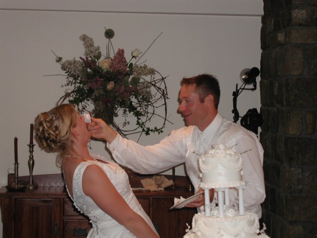 Garrett feeds Jess some of the delicious wedding cake